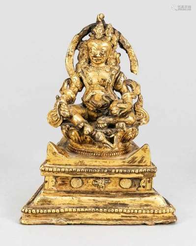 Vaishravana, Tibet, probably 18th century, bronze fire-gilt. Multi-profiled base thatwidens