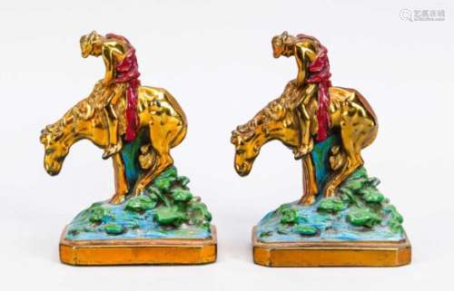 Paar Buchstützen in Form von resignierten Reitern (und Pferden), 1. H. 20. Jh.,Metallguss, bronziert