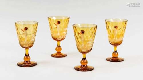 Four Biedermeier glasses, mid-19th century, round stand, baluster shaft, conical top,amber-colored