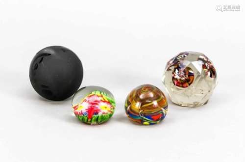 Four paperweights, 20th century, round shape, 1 with cut decor, 3 clear glass withpolychrome