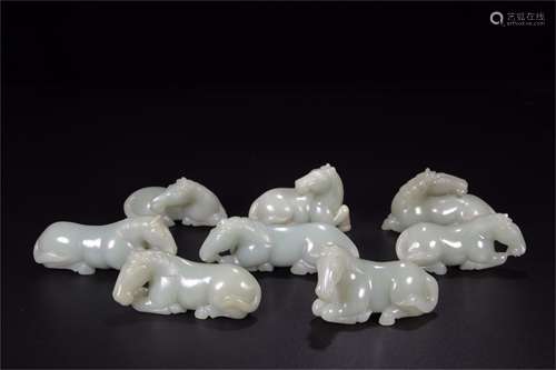 A Set of Eight Chinese Carved Jade Decorations