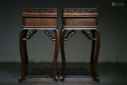 A Pair of Chinese Carved Hardwood Stands