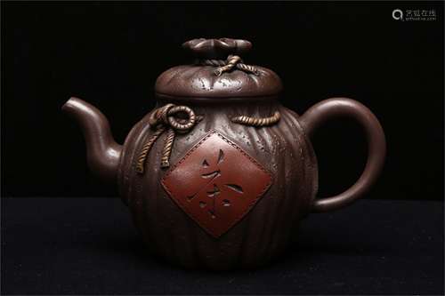 A Chinese Carved Yixing Clay Teapot