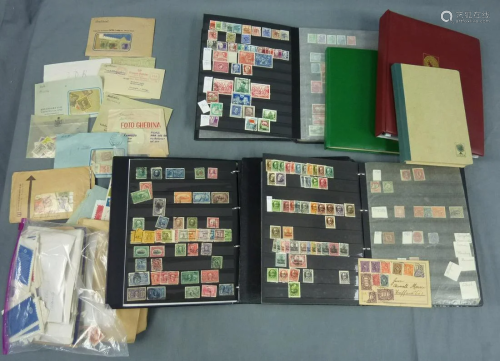 Stamp collection in 6 albums and two envelopes.