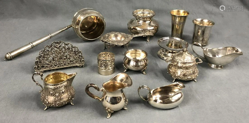 Silver. Also a trowel, vases, cups, tea strainer on