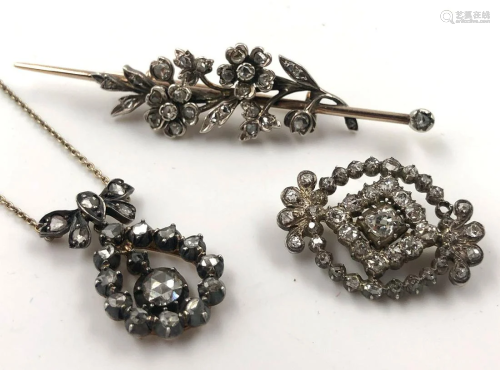 Two brooches and a necklace. Diamonds, gold…