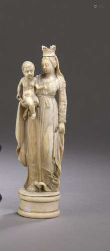 VIRGIN TO THE CHILD in ivory carved in a round hum…