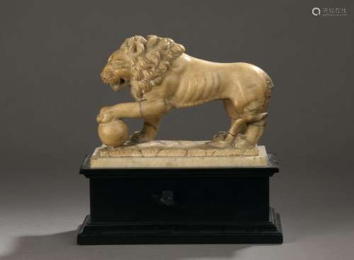 LION in alabaster carved in the round on a natural…