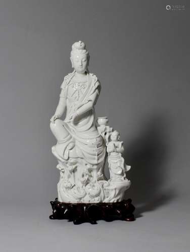 A White-Glazed Figure of 'Guanyin and Child', 19th Century
19世纪 童子拜观音德化瓷像