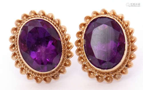 Pair of hallmarked 9ct gold and amethyst earrings, the oval shaped amethysts bezel set and raised in