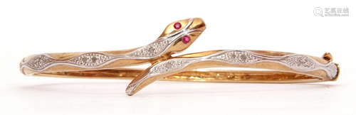 Modern 9ct gold diamond and ruby snake bracelet, hinged design, the serpent with 2 small ruby