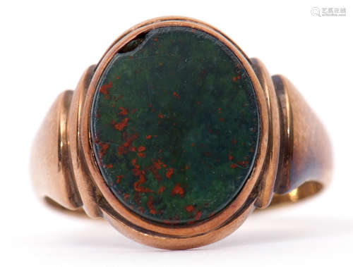 Antique gent's 9ct gold bloodstone set signet ring, the oval shaped panel framed and raised