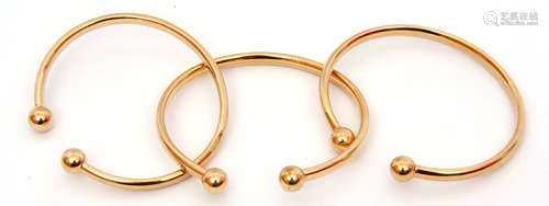 Three 9ct gold torque bangles, plain polished design, 17gms