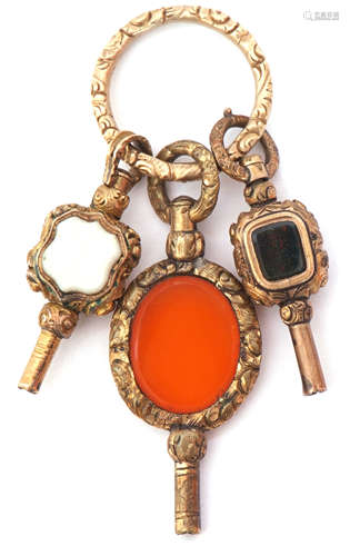 Mixed Lot: three Victorian gilt metal pendant watch keys, circa 1890, one set with oval carnelian