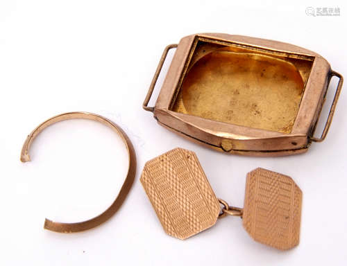 Mixed Lot: one 9ct gold cuff link, a 9ct gold wrist watch case, a broken 9ct gold earring, gross