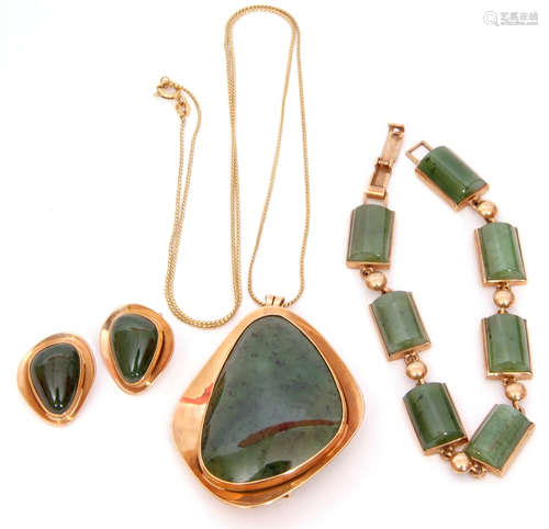 Mixed Lot: A Jade panelled bracelet, a large stylised jade pendant and chain, matching clip-on