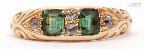 Antique 18ct gold emerald and diamond ring featuring 2 cushion cut emeralds interspersed with 5