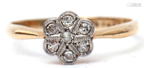 Precious metal diamond cluster ring featuring seven single cut diamonds in a flower head design,