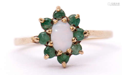 Modern 9ct gold opalescent and emerald cluster ring, the oval cabochon centre opalescent within a