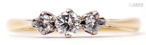 Three-stone diamond ring featuring 3 graduated brilliant cut diamonds, raised in upswept