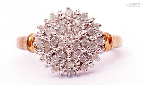 Modern diamond and cluster ring, a circular shaped panel set with small single cut diamonds, total