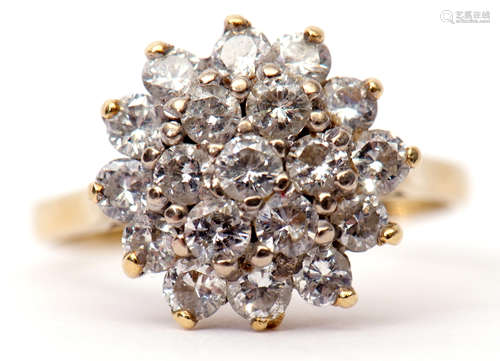 Diamond cluster ring, a design of two tiers of small round brilliant cut diamonds (19) stamped 18ct,