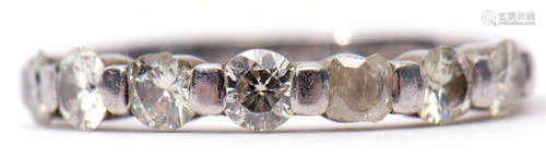 Precious metal 7-stone diamond ring, line set with 7 small diamonds (5 with chips/losses), stamped