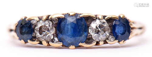 Antique sapphire and diamond ring featuring three circular shaped sapphires and two small