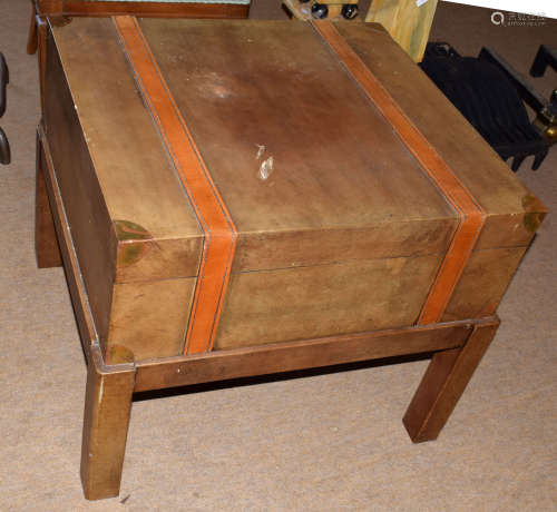 Modern designer side table with drawer, modelled as a leather travelling trunk on stand, 66cm wide