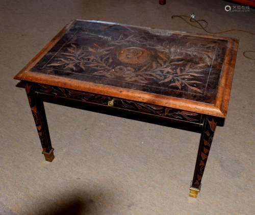 20th century coffee table with drawer, the top carved with leaves and portrait, inscribed 