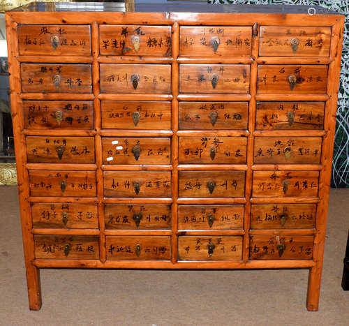 20th century Chinese medicine cabinet, 28 drawers decorated with Chinese inscriptions, 132cm wide