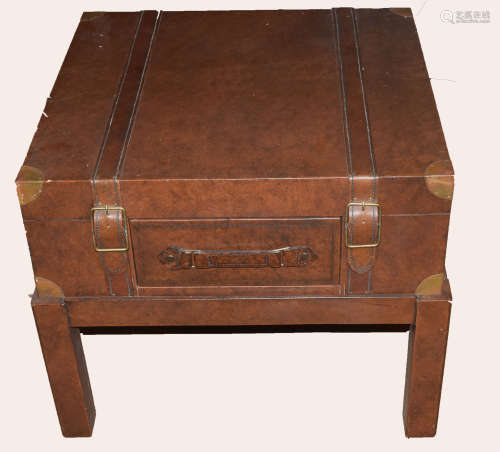 Modern designer side table with drawer modelled as a leather trunk on stand, 66cm wide