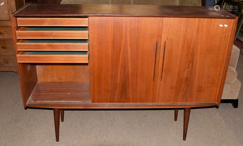 Mid-century teak cabinet with three sliding doors, the left hand side fitted with four drawers,