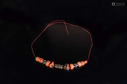 Arte Himalayana A dzi and coral necklaceTibet, 19th century .