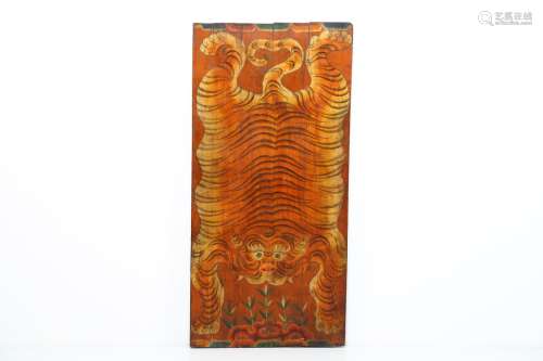 Arte Himalayana A wooden lacquered panel painted with tiger skinTibet, early 20th century .