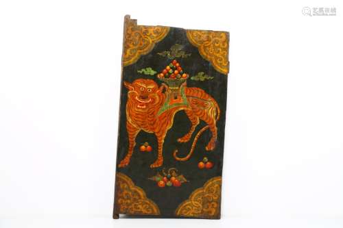 Arte Himalayana A large wooden door painted with a tiger carrying a tray with cintamani Tibet, 19th