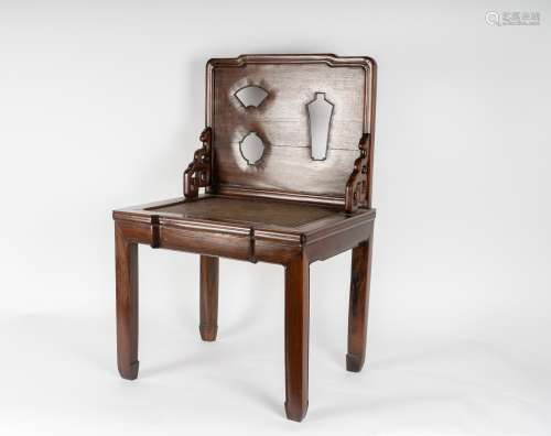 Arte Cinese A huanghuali chair with seatback carved with the silhouette of antiqueties China, first