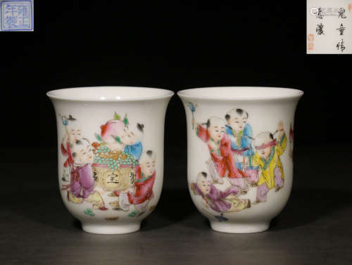 A PAIR OF FAMILLE ROSE BOYS PLAYING CUPS