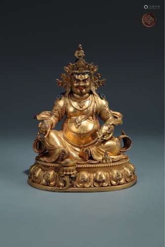 A FINE BRONZE GILT SITTING YELLOW FIGURE OF THE WEALTH BUDDHA MING DYNASTY