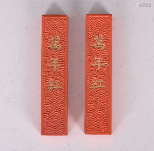 PAIR OF INSCRIBED RED ZHUSHA INK STICKS