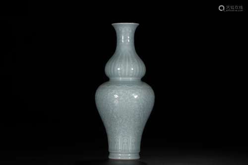 A PALE CELADON GLAZED LOW RELIEF LOTUS GOURD VASE QING DYNASTY QIANLONG PERIOD