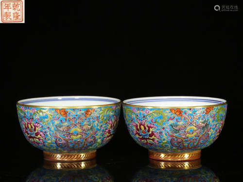 PAIR OF FAMILLE ROSE BLUE GROUND AND GILT 'FLOWERS AND VINES' BOWLS