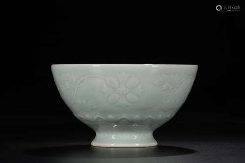 A CELADON GLAZED LOW RELIEF FLORALS BOWL QING DYNASTY QIANLONG PERIOD