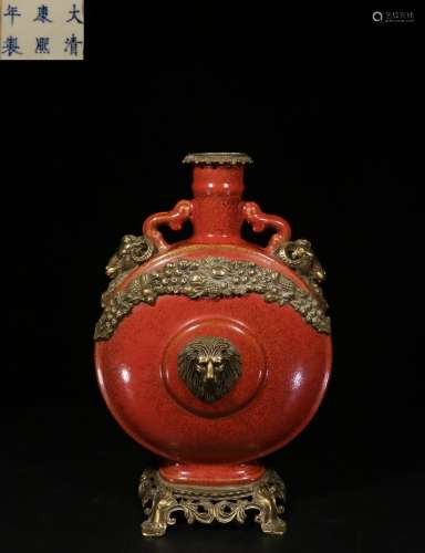 MONOCHROME RED GLAZED AND BRONZE ENCLOSED MOON FLASK