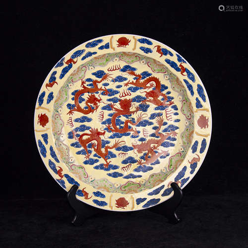 A FAMILLE ROSE YELLOW GLAZED FIVE-DRAGONS PLATE