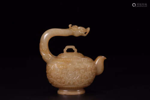 A HETIAN JADE CARVED FLORALS WITH A DRAGON HANDLE TEA POT QING DYNASTY
