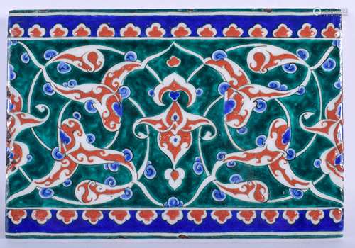 A MIDDLE EASTERN TURKISH IZNIK POTTERY TILE painted