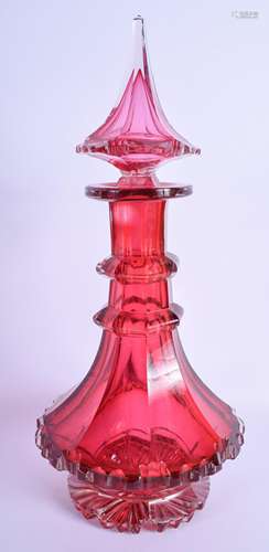 A LARGE ANTIQUE CRANBERRY GLASS LIQUOR DECANTER AND