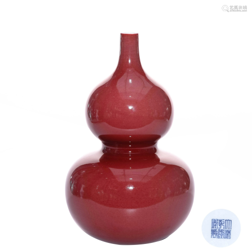 A CHINESE RED GLAZED PORCELAIN GOU…