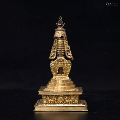 A CHINESE GILDED BRON…